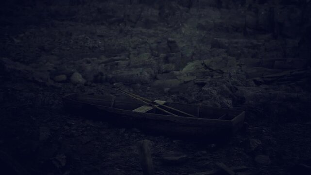 Low light tidal graveyard of boats, shattered hulls and tangled ropes among rocks, heavy shadows and grainy film aesthetic evoke noir salvage scene with quiet