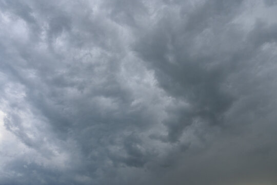 Dense dark storm clouds typical of thunderstorm or gale weather conditions often preceding brief