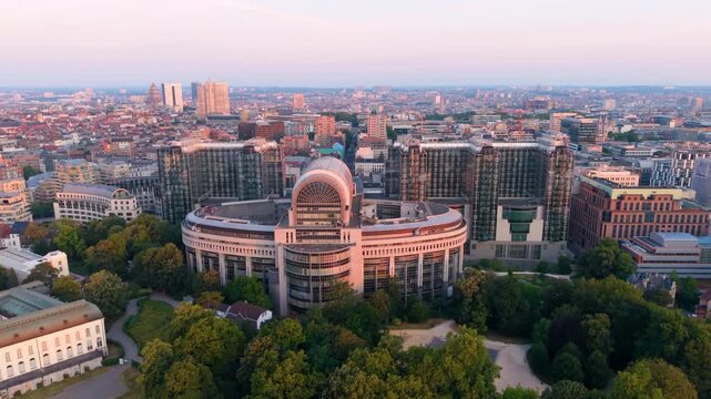 Aerial View of a modern city skyline with buildings and green areas during sunset. European Parliament. Bruxelles. Belgium