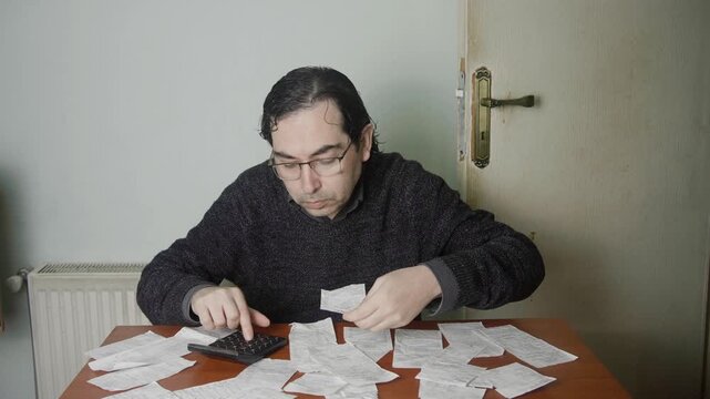 Mid Shot of Angry Man Sweeping Receipts off Desk and Walking Away