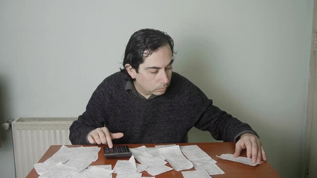 Caucasian Man Throwing Financial Papers Away and Resting Head in Frustration, Mid Shot of Angrily Sweeping Receipts Off Desk and Slumping Head Down