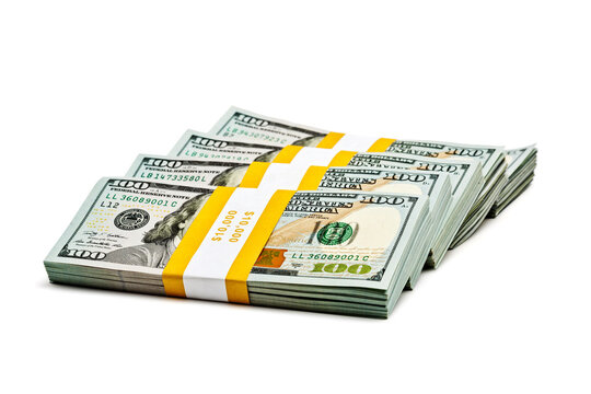 A creative business finance making money concept - stack of bundles of 100 US dollars 2013 edition banknotes bills isolated on white