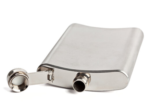 Scene featuring stainless hip flask isolated on white background