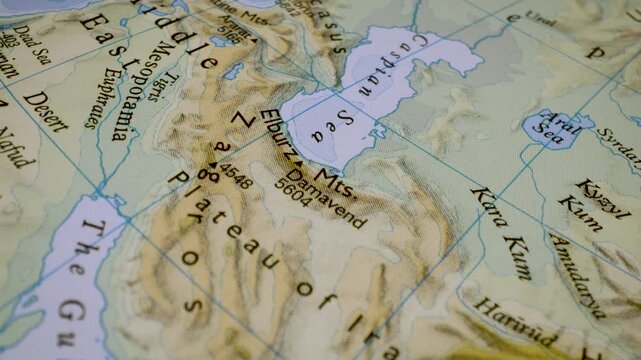 gliding macro view from the middle east to the iranian plateau on a physical atlas map