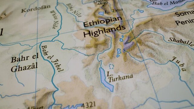 gliding macro view to the ethiopian highlands on a physical atlas map