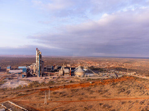 Aerial view of Simba Cement Merueshi industrial plant featuring large silos and processing structures set within the arid landscape of Kajiado, Kajiado County, Kenya.