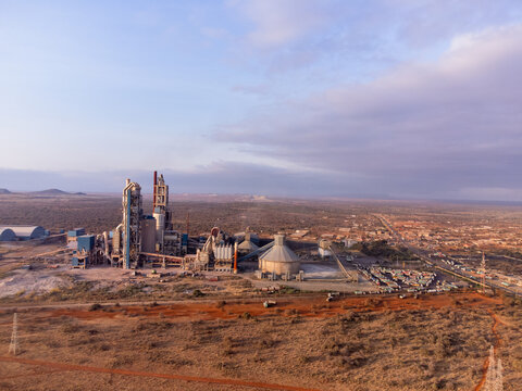 Aerial view of Simba Cement Merueshi plant with industrial structures, silos, and surrounding arid landscape in Kajiado, Kajiado County, Kenya.