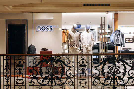 Monaco, Monaco - July 17, 2026: BOSS menswear boutique window with mannequins and a Beckham x BOSS display inside Metropole Shopping Monte-Carlo