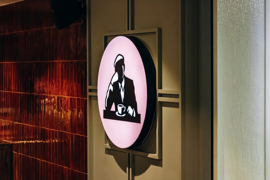 Monaco, Monaco - July 17, 2026: Circular illuminated Joe and The Juice logo inside the Metropole Shopping Monte-Carlo shopping centre