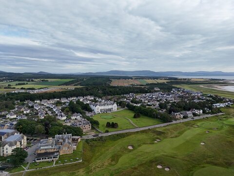 Dornoch is a historic Scottish Highland town with a 1224 cathedral, 1509 castle, charming streets, surrounding countryside, and dramatic northern skies.