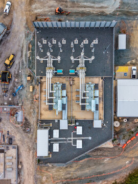 Aerial view of the Brendale BESS facility featuring large transformers and electrical infrastructure surrounded by gravel grounds and construction equipment in Brendale, Queensland, Australia.