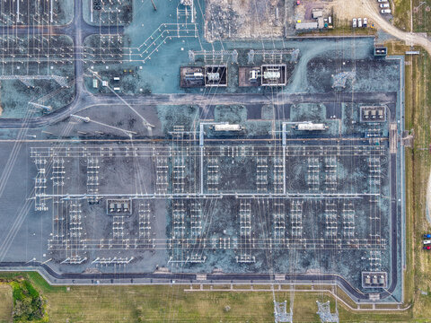 Aerial view of the Brendale BESS electrical substation featuring complex power lines, transformers, and grid infrastructure in Brendale, Queensland, Australia.