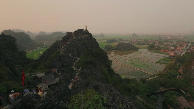 Vie of Hang Mua pagoda in North Vietnam, Ninh Binh province, with tourists going up and down the stairs