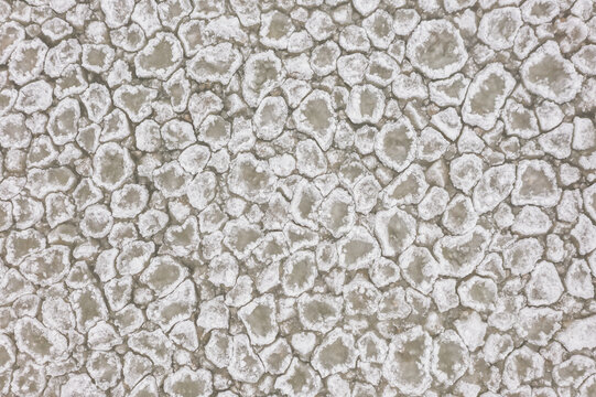 Aerial view of pancake ice formations floating on the surface of Lake Huron near Sturgeon Point Lighthouse in Harrisville, Michigan, United States.