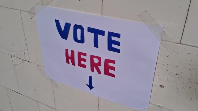 Vote here directional sign for election