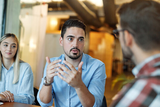 Business people having a meeting in the office. Teamwork and success concept, portrait of a smart young black businessman, two young businessmen talking planning brainstorming