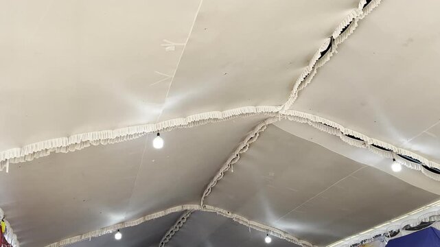 Top view inside party tent fabric ceiling with lighting decoration