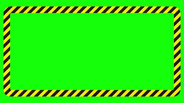 Industrial yellow and black striped hazard warning frame border on green screen