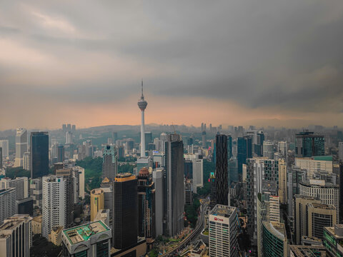 08 02 2026 - Kuala Lumpur, Malaysia. Aerial drone night panorama of Kuala Lumpur, Malaysia, illuminated Petronas Twin Towers and iconic skyscrapers with dramatic lightning in the stormy background