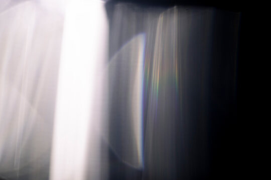 Abstract caustic light patterns created by refraction and reflection on a transparent surface. Can be used as overlay elements for design projects. 