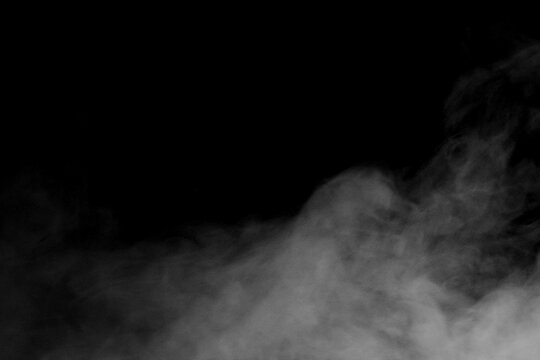 Realistic smoke effect drifting and spreading in freeze motion against a black background. Cinematic atmospheric fog ideal for VFX compositing, overlays, transitions, and moody visual effects.