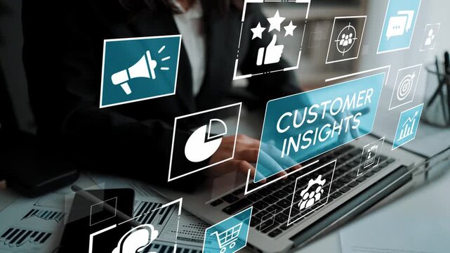 Business professional working on laptop with digital customer insights analysis and various marketing icons in a modern office environment. Entropy.