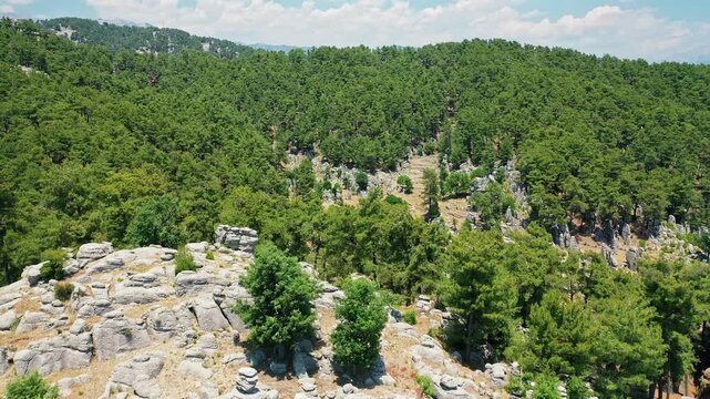 Manavgat Adam Kayalar aerial view showing fantastic conglomerate rocks in Antalya Turkey. Majestic drone shot of unique "Man Rocks" formation surrounded by nature.