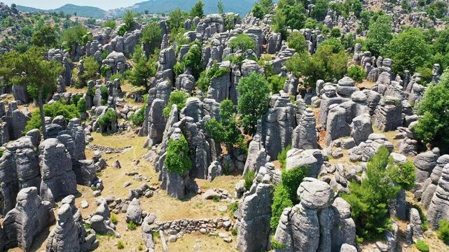 Manavgat Adam Kayalar aerial view showing fantastic conglomerate rocks in Antalya Turkey. Majestic drone shot of unique "Man Rocks" formation surrounded by nature.