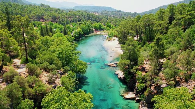 Aerial view of Koprulu Canyon in Manavgat, Antalya, showcasing the dramatic river gorge and lush green forest landscape. Majestic drone shot over Turkey's famous national park.