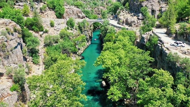 Aerial view of Koprulu Canyon in Manavgat, Antalya, showcasing the dramatic river gorge and lush green forest landscape. Majestic drone shot over Turkey's famous national park.