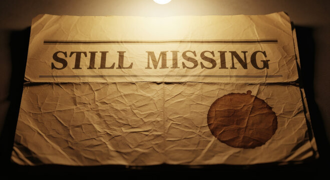 Vintage newspaper headline still missing with coffee stain