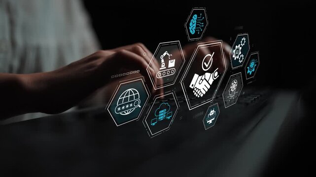 Business professional working on a laptop with digital icons representing technology, industry, and connectivity in a modern workspace. Entropy.
