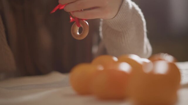 Warm bokeh highlights delicate linen textures. Gentle blurring emphasizes ribboned bagel and tranquil mood. Muted colors and tactile textures evoke calmness and subtle citrus atmosphere