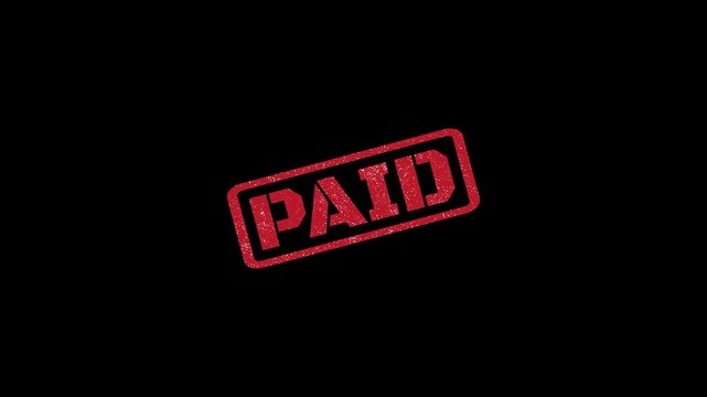 Paid rubber stamp seal with distressed texture stamping animation on black background 4k