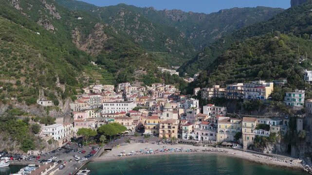 Aerial view of the coastal village of Cetara with its beach, colorful buildings, and surrounding mountains, Cetara, Amalfi Coast, Campania, Italy.