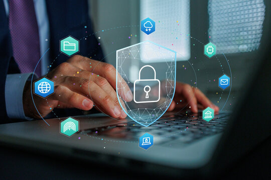 Hands typing on a laptop with a digital shield and padlock protecting network connections and sensitive information