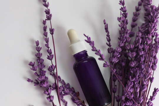 Lavender essential oil bottle for aromatherapy and wellness on white background