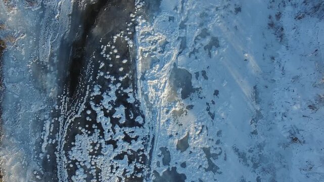 Aerial drone footage shows a frozen river amid Russia's severe winter conditions.
