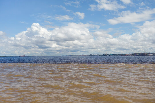 bands of water with different colorations in junction of Negro river and Amazonas river. Manaus, Brazil