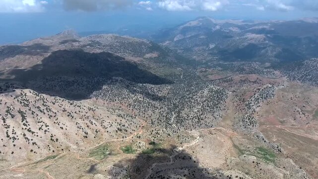 Aerial view of sparsely forested mountains and valleys in northern Algeria geography.