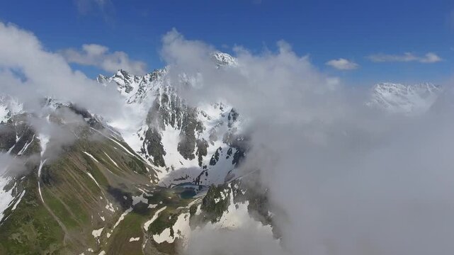 Avusor Plateau Kemerli Kackar Mountain Rize Turkey lake sits below snowy peaks basin.