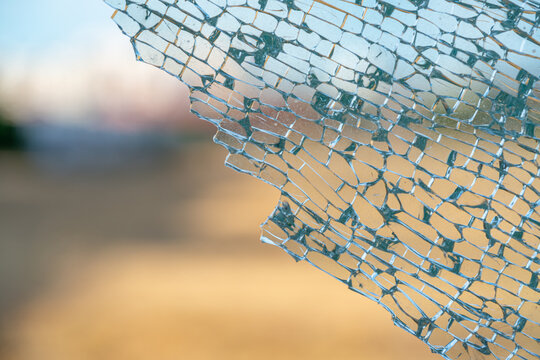 Broken tempered glass window in detail.