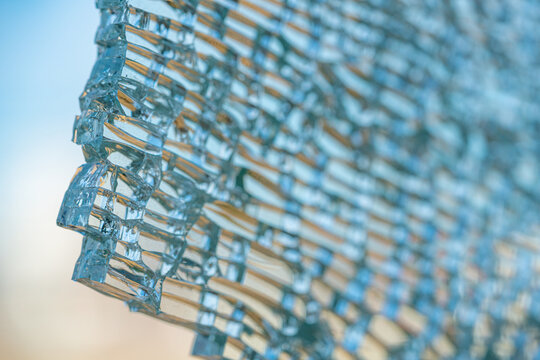 Broken tempered glass window in detail.