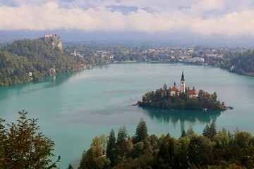 Naklejka premium Aerial view of Lake Bled island church and turquoise alpine water