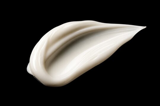 Squeezed fresh toothpaste globule on black background, close-up macro photography showcasing smooth texture and creamy white color, hygiene, dental care concept