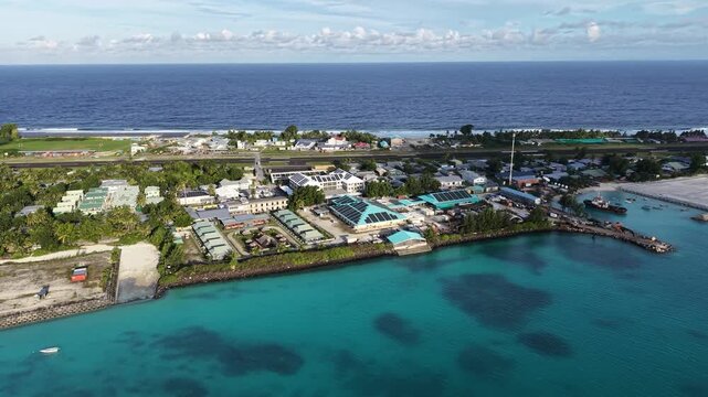 Aerial view of central Fongafale, Funafuti Atoll, Tuvalu with airport runway, lagoon and coastal settlement