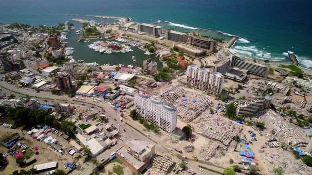 Harrowing drone perspective revealing scale of urban destruction, with fractured buildings and debris contrasting against the intact harbor