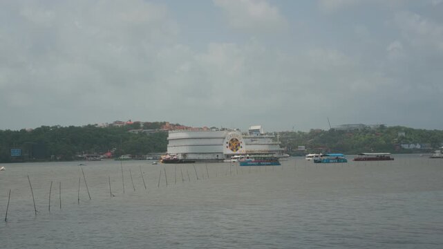 Majestic Pride Casino sits on the Mandovi River as boats pass by in Panjim, Goa