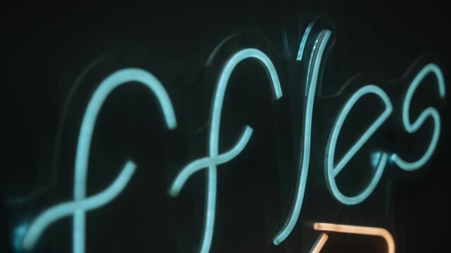 A cursive neon sign spells out Waffles above a glowing grid light fixture