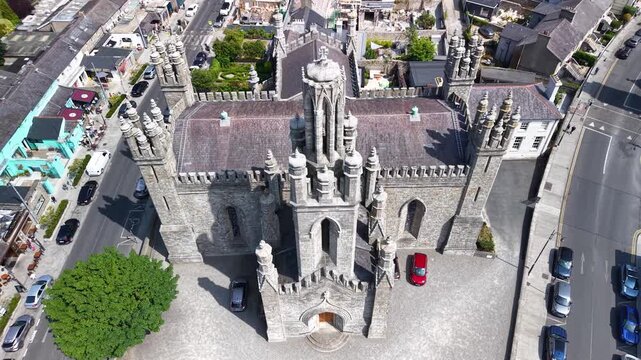Beautiful aerial reveal over Monkstown Church to seaside, Dun Laoghaire cityscape Dublin.
